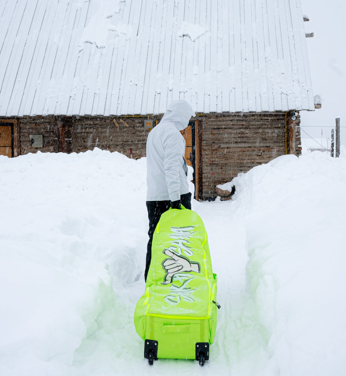 SHAKA ski and snowboard travel bag packed for a mountain trip